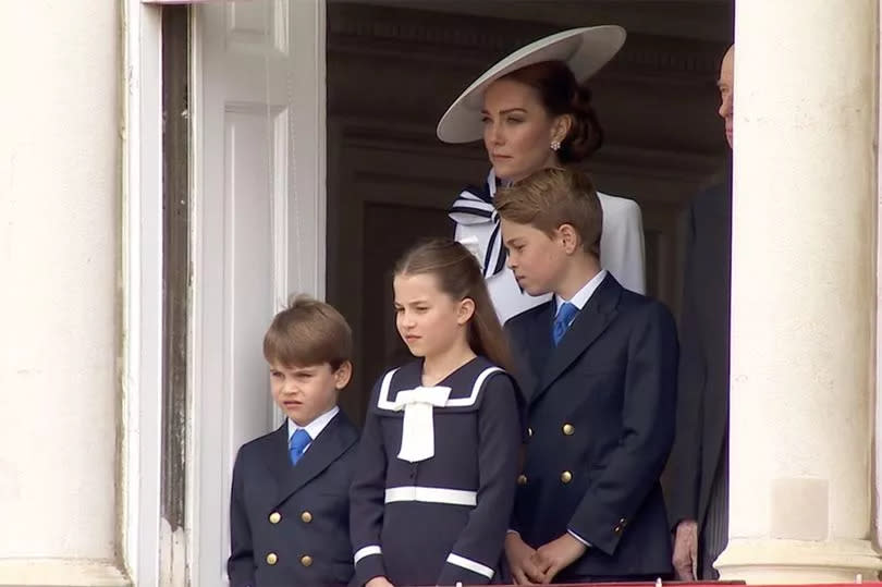 Kate Middleton with Louis, Charlotte and George on a balcony