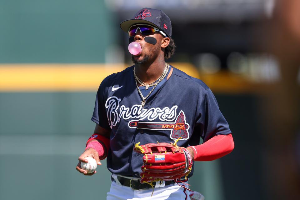 Ronald Acuna Jr. warms up before a spring training game.