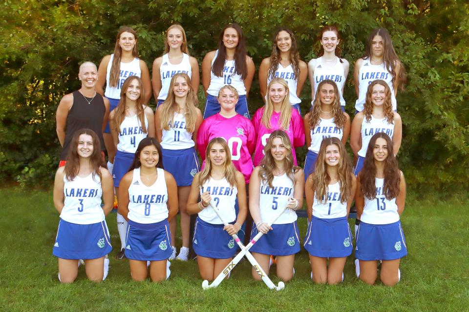 Coach Shawn Lefebvre (far left, middle row) and players on Colchester High School field hockey pose for the 2023 team photo.