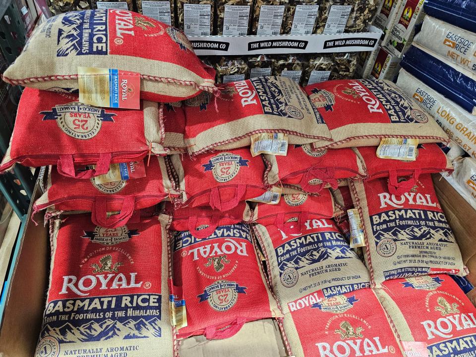 large bags of basmati rice in piles at Costco