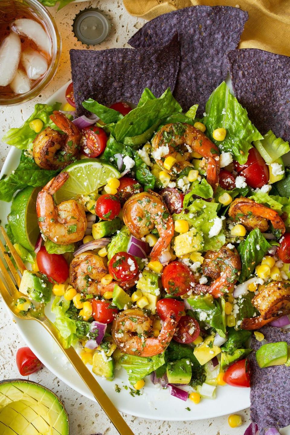 <p>The fresh cilantro-lime vinaigrette on this salad is really what brings all the ingredients together. Hot tip: The recipe suggests cooking the shrimp in a skillet, but there’s no better time to try cooking it on the grill instead. </p> <p>Get the recipe <a href="https://www.cookingclassy.com/shrimp-avocado-taco-salad/" rel="nofollow noopener" target="_blank" data-ylk="slk:here;elm:context_link;itc:0;sec:content-canvas" class="link ">here</a>.</p>
