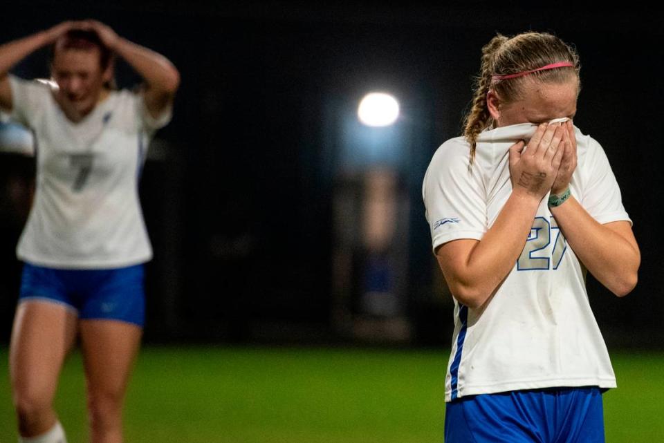 Ocean Springs’ Jaylen Bodry and Ava Green react after their team loses the 6A South State Championship game in Gulfport on Tuesday, Jan. 31, 2023.