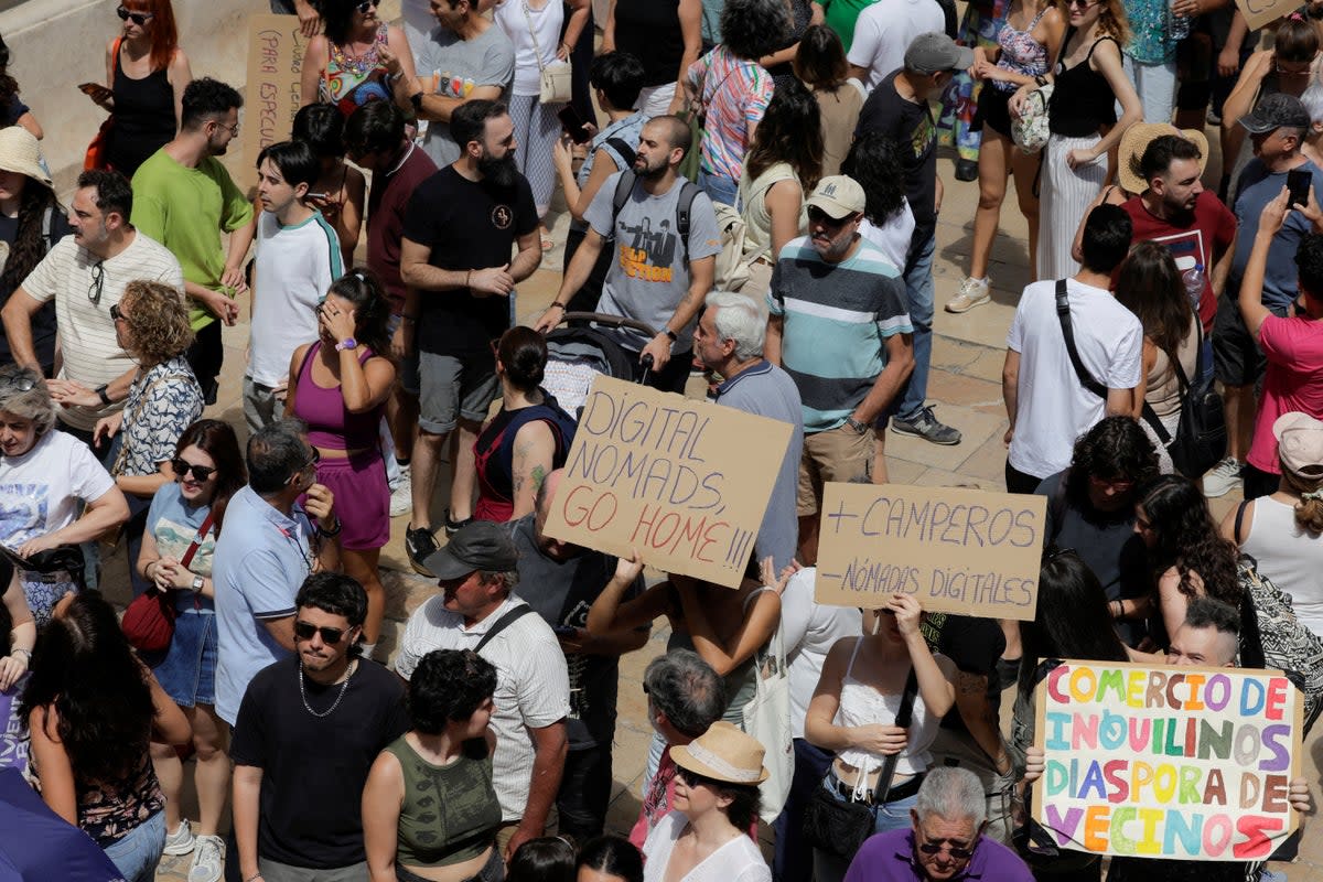 Demonstrators protest mass tourism in Málaga, Spain (REUTERS)