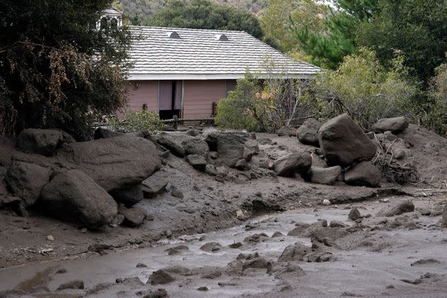 The front yard of a property is covered in mud in the aftermath of a mudslide Tuesday in Oak Glen. (Photo: Marcio Jose Sanchez via Associated Press)