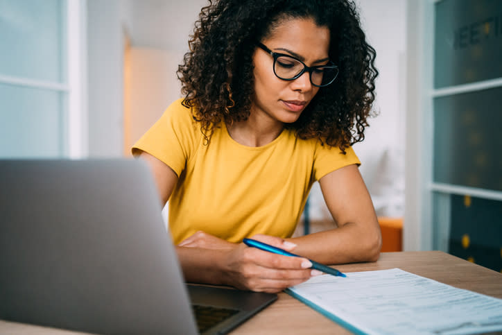 A woman calculates her tangible net worth