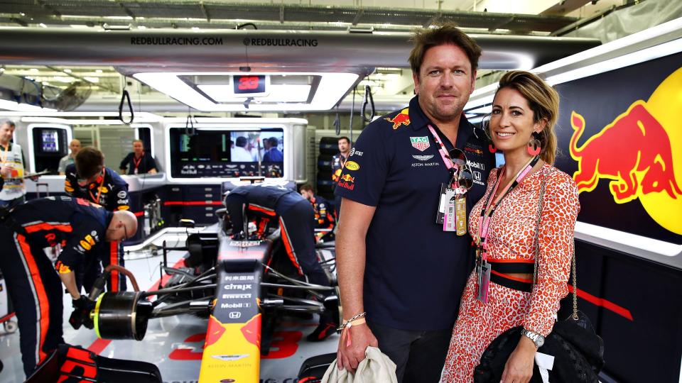 James Martin and Louise Davies with a Red Bull F1 car behind them