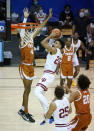 Indiana forward Trayce Jackson-Davis (23) shoots in front of Texas forward Greg Brown (4) in the first half of a semifinal NCAA college basketball game in the Maui Invitational tournament, Tuesday, Dec. 1, 2020, in Asheville, N.C. (AP Photo/Kathy Kmonicek)