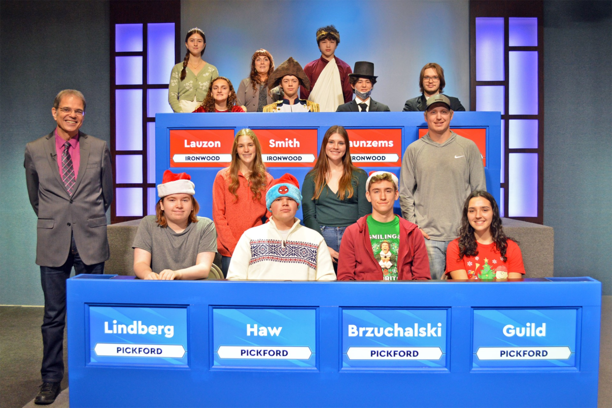 Representing Pickford are (seated from left) Finley Guild, Oliver Brzuchalski, team captain Lucas Haw and Jackson Lindberg. Standing are alternates Ava Nettleton and Teryn Firack with coach Garde Kangas. Players for Ironwood (seated from left) are players Jacinta Lauzon, Zachary Smith, team captain Nathan Jaunzems and Peter Gallo. Standing are alternates Madelena Braucher and Mark Jaunzems with coach Cheryl Jacisin. High School Bowl host Jim Koski is standing at lower left.