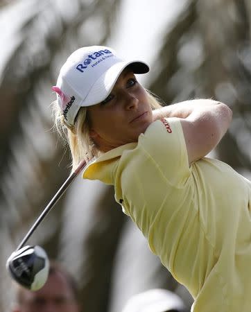 Melissa Reid of Britain watches her shot on the 2nd tee during the final round of the Dubai Ladies Masters December 13, 2014. REUTERS/Caren Firouz/Files