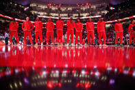 The Toronto Raptors line up for the Canadian national anthem prior to NBA basketball game action against the Washington Wizards in Toronto, Sunday, Dec. 5, 2021. (Cole Burston/The Canadian Press via AP)