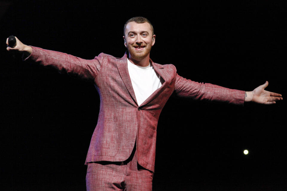 FILE - This June 29, 2018 file photo shows Sam Smith performing at Madison Square Garden in New York. Smith is set to perform on the iHeartRadio Jingle Ball Tour this holiday season. IHeartMedia announced Friday, Sept. 27, 2019, that the 12-city tour kicks off Dec. 1 in Tampa Bay, Florida. (Photo by Andy Kropa/Invision/AP, File)