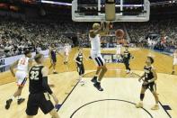 Mar 30, 2019; Louisville, KY, United States; Virginia Cavaliers forward Mamadi Diakite (25) dunks as Purdue Boilermakers guard Carsen Edwards (3) looks on during the first half in the championship game of the south regional of the 2019 NCAA Tournament at KFC Yum Center. Mandatory Credit: Jamie Rhodes-USA TODAY Sports