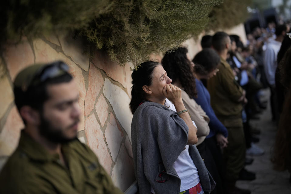 Mourners react during the funeral of Israeli soldier Benjamin Loeb, a dual Israeli-French citizen, in Jerusalem, Tuesday, Oct. 10, 2023. Loeb was killed on Saturday as the militant Hamas rulers of the Gaza Strip carried out an unprecedented, multi-front attack on Israel. (AP Photo/Francisco Seco)