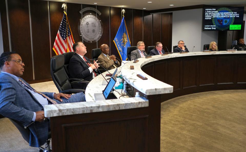 Oklahoma County jail trust members listen to public comment during a meeting in April.