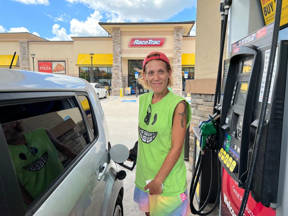 Daytona Beach motorist Jennifer Page refuels her car at the RaceTrac gas station on the corner of Beville Road and Williamson Boulevard on Monday, July 11, 2022. Page is a delivery driver for Instacart and DoorDash. "Every penny counts," she said of the slow, but steady decrease in gas prices since hitting a record high $4.895 a gallon locally a month ago. On Monday, the price for regular gasoline at RaceTrac was down to $4.329 a gallon.