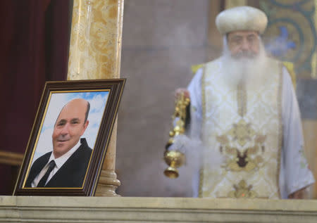 A picture of Medhat Michel, one of the Christian victims of the crashed EgyptAir flight MS804, is seen during an absentee funeral mass at the main Cathedral in Cairo, Egypt, May 22, 2016. REUTERS/Mohamed Abd El Ghany