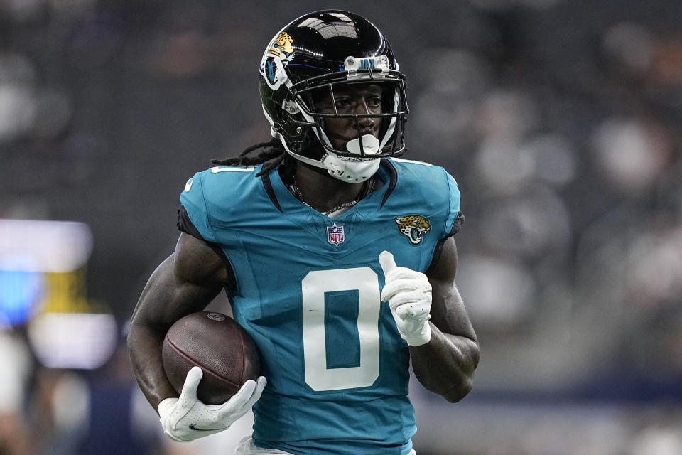 Jacksonville Jaguars wide receiver Calvin Ridley (0) runs drills before an NFL preseason football game against the Dallas Cowboys, Saturday, Aug. 12, 2023, in Arlington, Texas. (AP Photo/Tony Gutierrez)