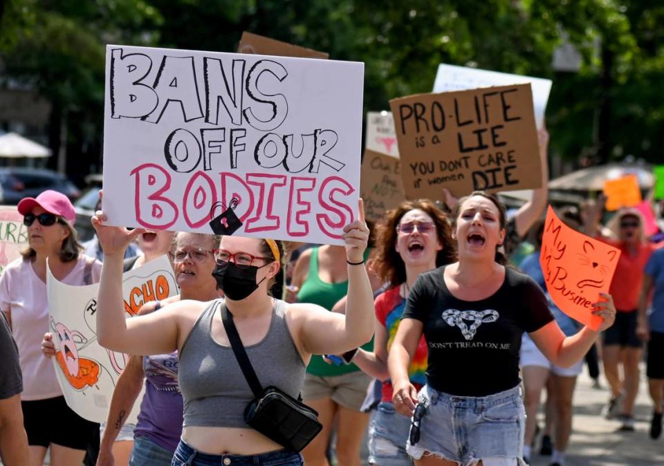 Hundreds of protesters march along Cherry Street Sunday during a pro-choice march and rally Sunday in downtown Macon.