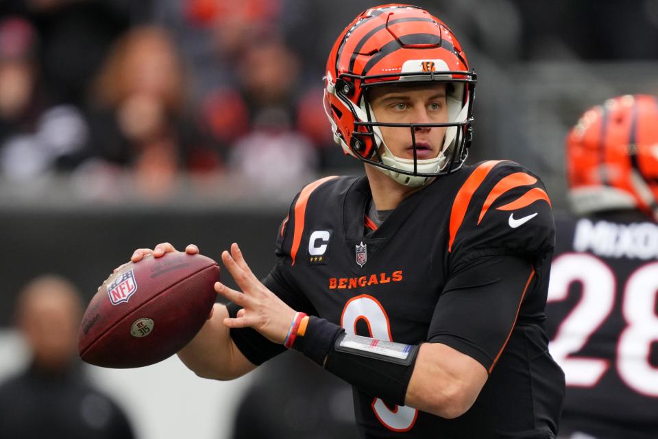 Cincinnati Bengals quarterback Joe Burrow (9) looks to throw in the second quarter during a Week 14 NFL game against the Cleveland Browns, Sunday, Dec. 11, 2022, at Paycor Stadium in Cincinnati. Mandatory Credit: Kareem Elgazzar-The Cincinnati Enquirer-USA TODAY Sports