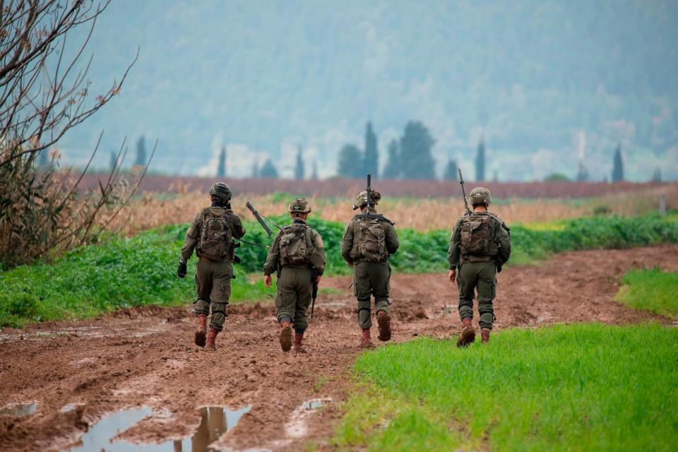 PHOTO: Israeli soldiers search a field after two drones allegedly crossed from Lebanese territory into Israel fell near the Kibbutz in Northern Israel, Jan. 25, 2024 in Kfar Blum, Israel.  (Amir Levy/Getty Images)