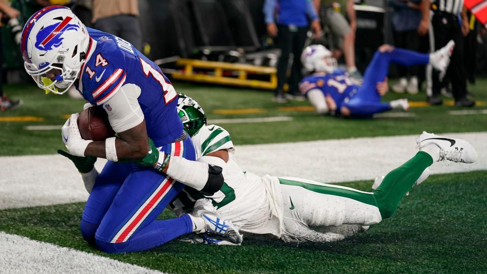 Buffalo Bills wide receiver Stefon Diggs (14) makes a touchdown catch against New York Jets cornerback Michael Carter II (30) during the second quarter of an NFL football game, Monday, Sept. 11, 2023, in East Rutherford, N.J. (AP Photo/Seth Wenig)