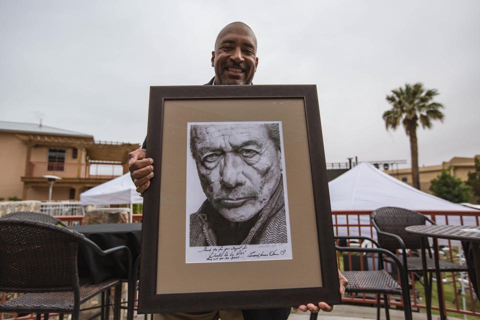 Dusty Richardson shows off his artwork of Edward James Olmos at the "Walking With Herb" world premiere at Amador Live in Las Cruces on Thursday, April 29, 2021.