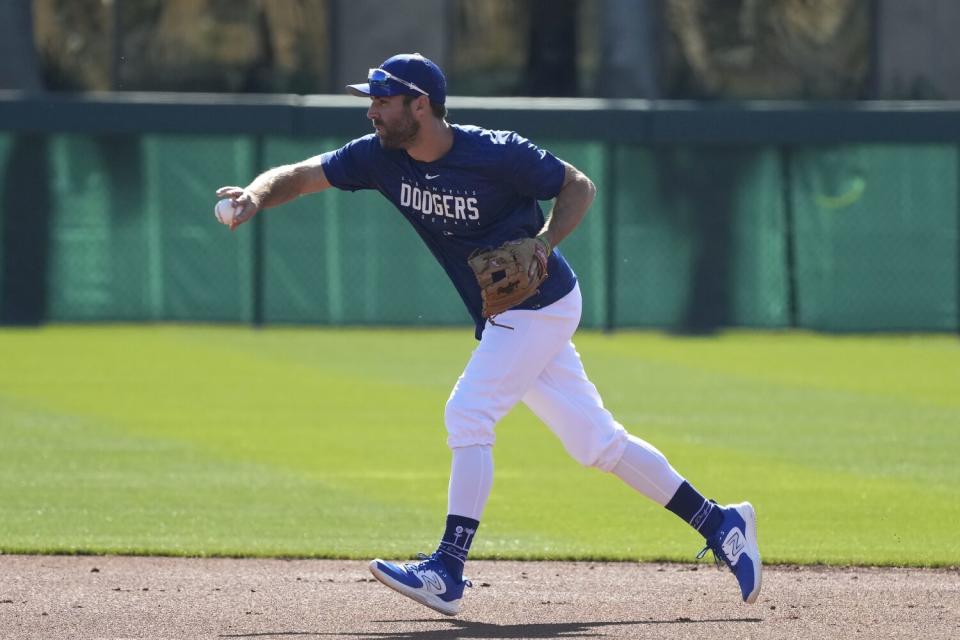 Chris Taylor works on infield drills during spring training on Feb.  20, 2023.