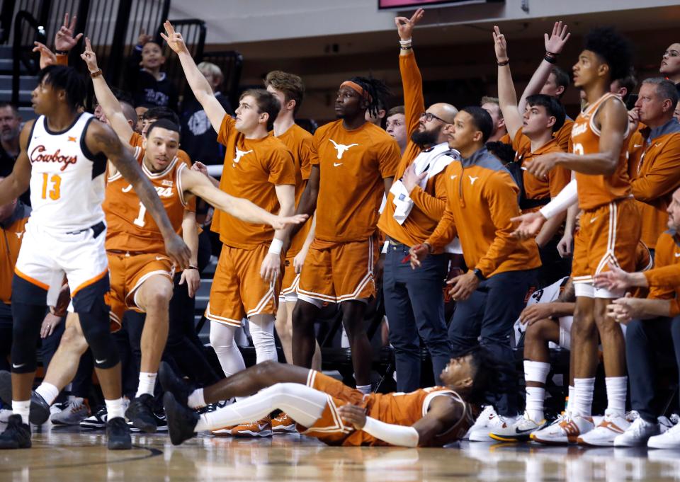 Texas guard Marcus Carr makes a 3-pointer as his teammates celebrate during Saturday's 56-46 win at Oklahoma State. The Horns host TCU on Wednesday in an important Big 12 matchup of two nationally-ranked teams.