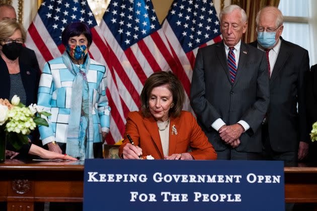 Speaker of the House Nancy Pelosi (D-Calif.) conducts a bill enrollment ceremony for the Further Extending Government Funding Act in the U.S. Capitol on Dec. 3, 2021.