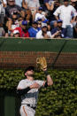 San Francisco Giants left fielder Kris Bryant catches a fly ball hit by Chicago Cubs' Ian Happ during the sixth inning of a baseball game in Chicago, Friday, Sept. 10, 2021. (AP Photo/Nam Y. Huh)