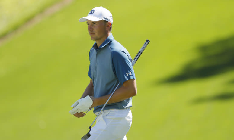 A closeup of Jordan Spieth on the golf course.