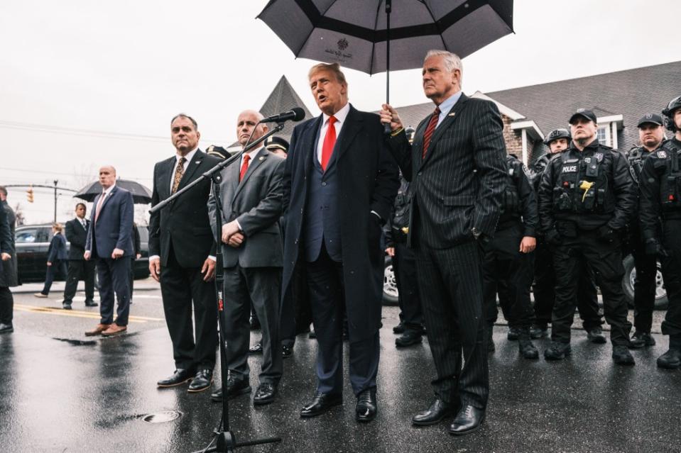 Former President Donald Trump stands with Nassau County Executive Bruce Blakeman outside the Massapequa Funeral Home where a wake was held for slain NYPD cop Jonathan Diller. Stephen Yang for NY Post