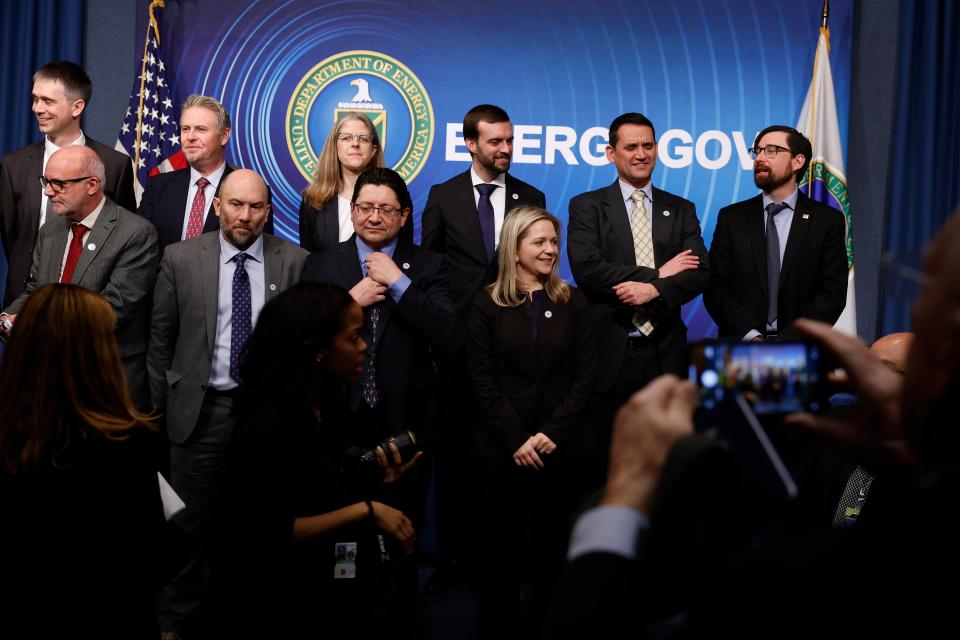 Scientists, engineers and administrators from the Lawrence Livermore National Laboratories prepare for a group photograph at the Department of Energy (Getty Images)