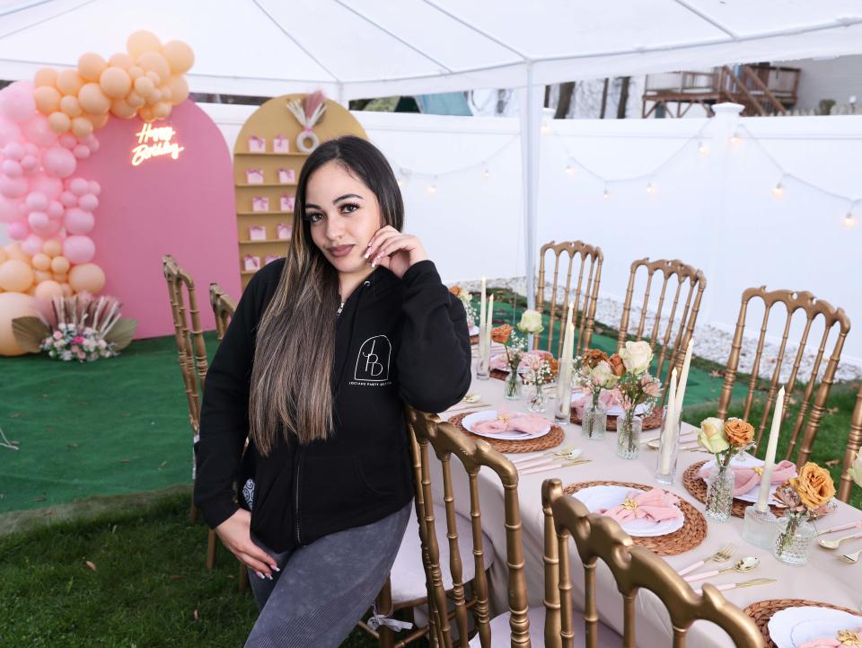 Cynthia Viruet, owner of Jociah Party Decor, at a house party on North Main Street in Brockton on Saturday, April 20, 2024.