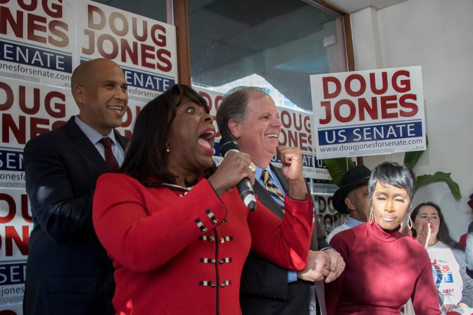Doug Jones campaigning on Sunday with Democratic Rep. Terri Sewell of Alabama (holding microphone) and Democratic Sen. Cory Booker of New Jersey (left). (Photo: JIM WATSON via Getty Images)