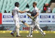 First Test cricket match - Saurashtra Cricket Association Stadium, Rajkot - 10/11/16. England's Ben Stokes (R) is congratulated by his teammate Zafar Ansari after scoring his century. REUTERS/Amit Dave