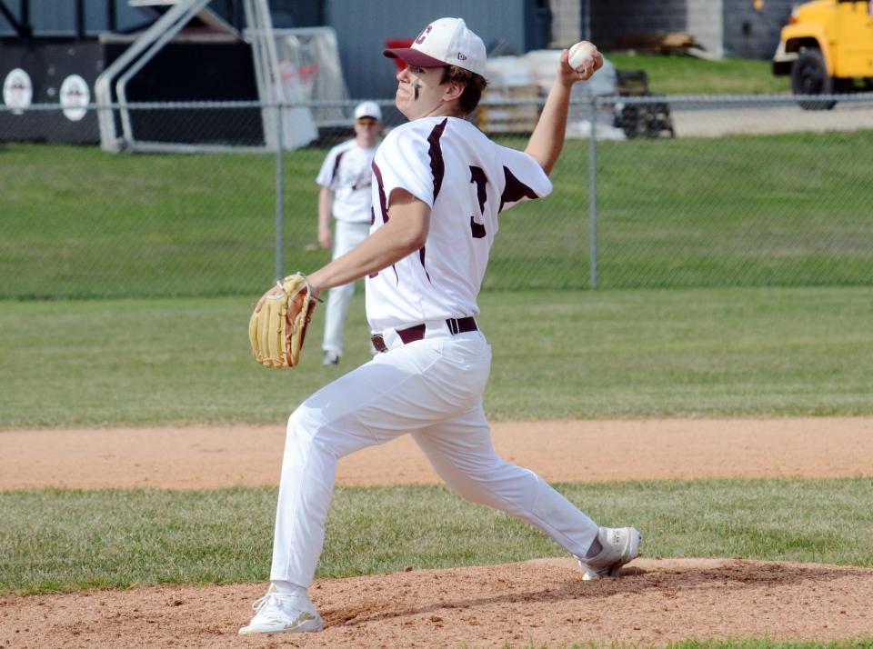 Charlevoix's Bryce Johnson reaches back to deliver a pitch during a 10-strikeout opener against Kalkaska.
