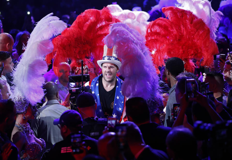 Tyson Fury, of England, enters the arena before a heavyweight boxing match against Tom Schwarz, of Germany, Saturday, June 15, 2019, in Las Vegas. (AP Photo/John Locher)