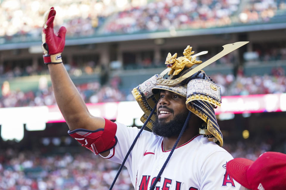 Los Angeles Angels' Luis Rengifo (2) celebrates in the dugout after hitting a home run during the first inning of a baseball game against the Seattle Mariners in Anaheim, Calif., Friday, Aug. 4, 2023. (AP Photo/Ashley Landis)