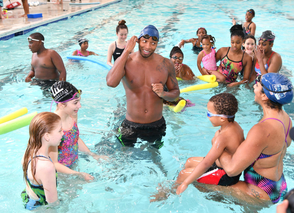 Cullen Jones, and Maritza Correia attend water safety and fitness at Carrie Steele Pitts Life Learning Center on April 30, 2016 in Atlanta, Georgia.