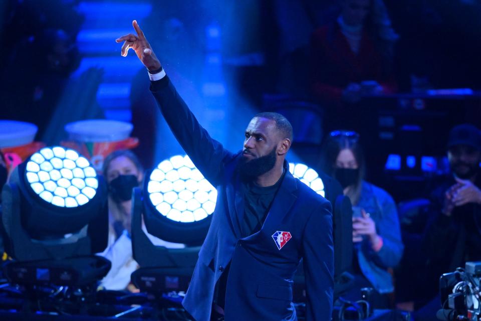 Lebron James waves to the crowd after being introduced.