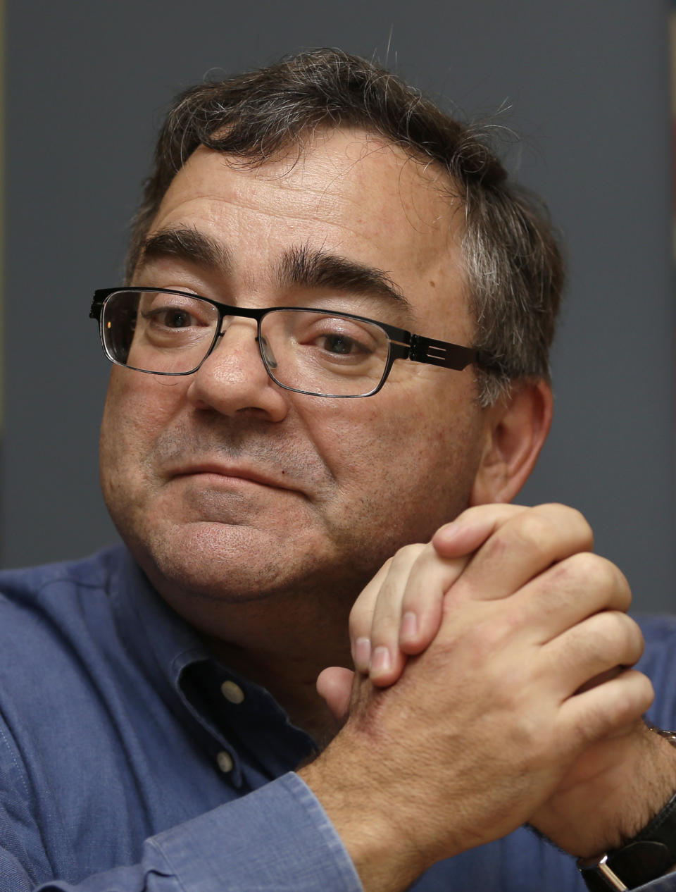 In this photo taken Thursday, Jan. 9, 2014, Spirit Airlines CEO Ben Baldanza pauses as he talks to a reporter at his home, in Fort Lauderdale, Fla. (AP Photo/Alan Diaz)