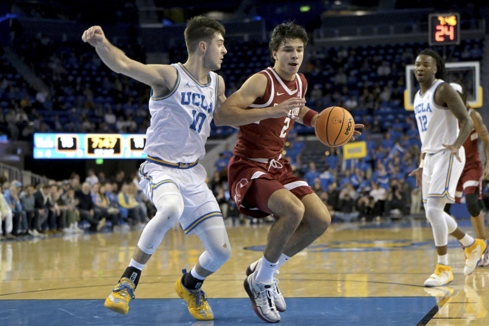 UCLA guard Lazar Stefanovic left, defends against Stanford guard Andrej Stojakovic during the first half of an NCAA college basketball game Wednesday, Jan. 3, 2024, in Los Angeles. (AP Photo/Jayne Kamin-Oncea)