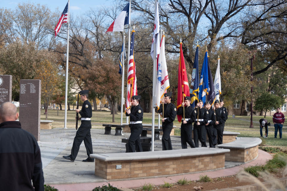 The Tascosa High School Navy JROTC Color Guard presents the U.S. flag with all U.S. military branch flags Friday at West Texas A&M University in Canyon.