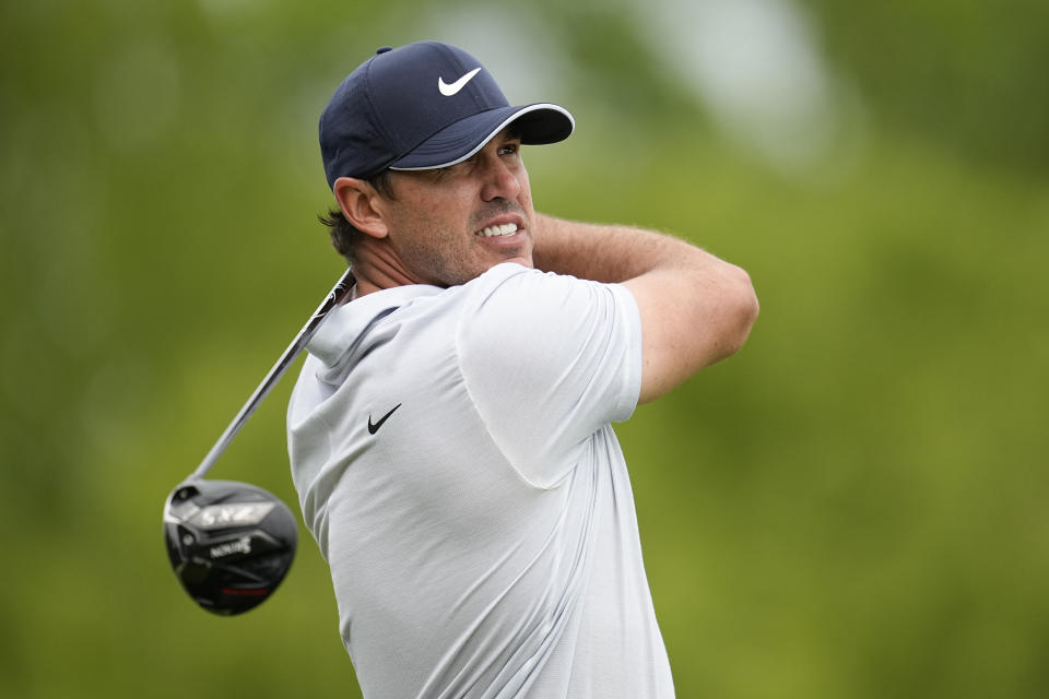 Brooks Koepka watches his tee shot on the ninth hole during the third round of the PGA Championship golf tournament at Oak Hill Country Club on Saturday, May 20, 2023, in Pittsford, N.Y. (AP Photo/Abbie Parr)