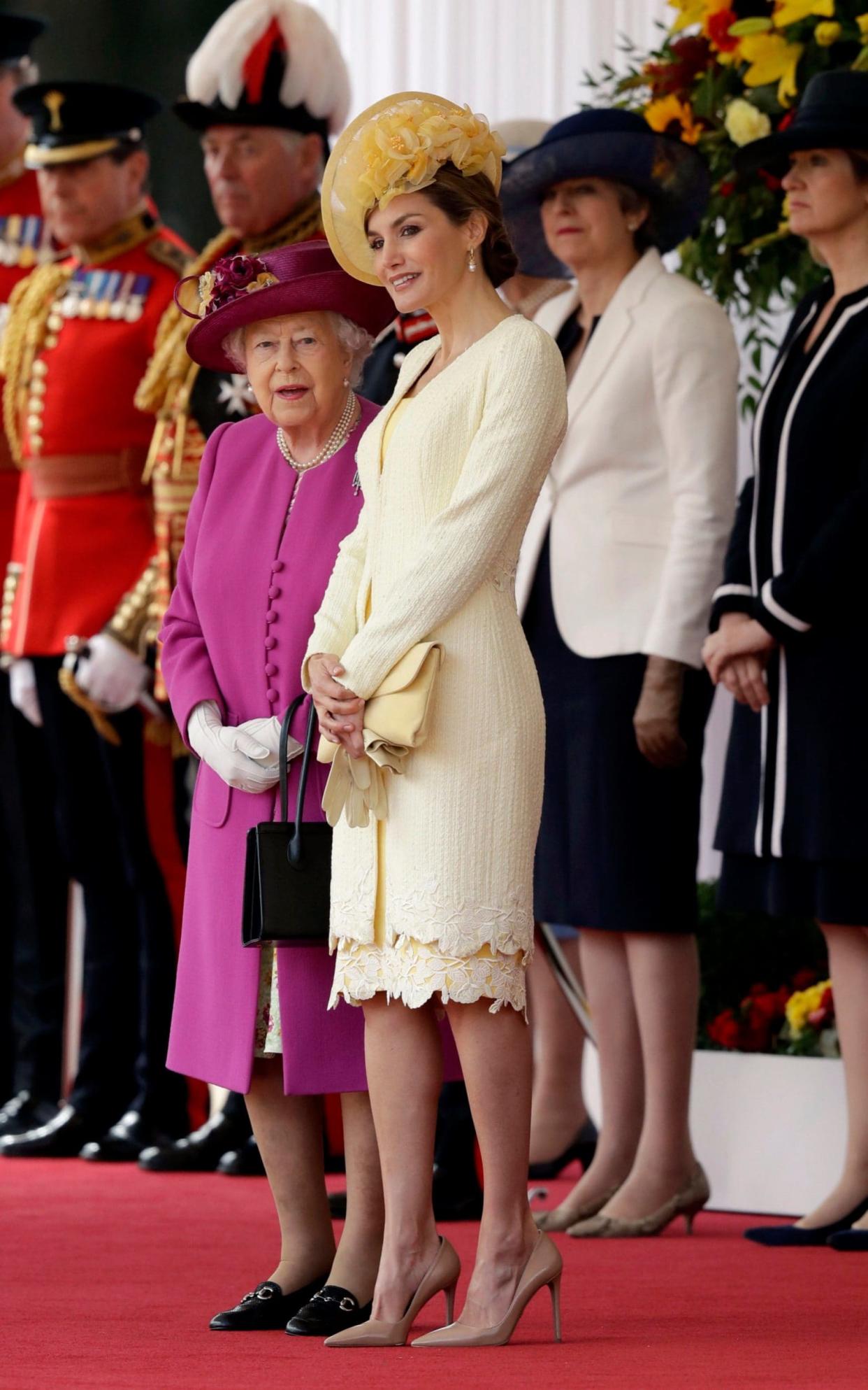 Queen Elizabeth II stands with Spain's Queen Letizia today - PA