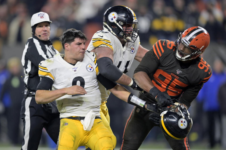 Cleveland Browns defensive end Myles Garrett (95) reacts after swinging a helmet at Pittsburgh Steelers quarterback Mason Rudolph (2) in the fourth quarter of an NFL football game, Thursday, Nov. 14, 2019, in Cleveland. The Browns won 21-7. (AP Photo/David Richard)