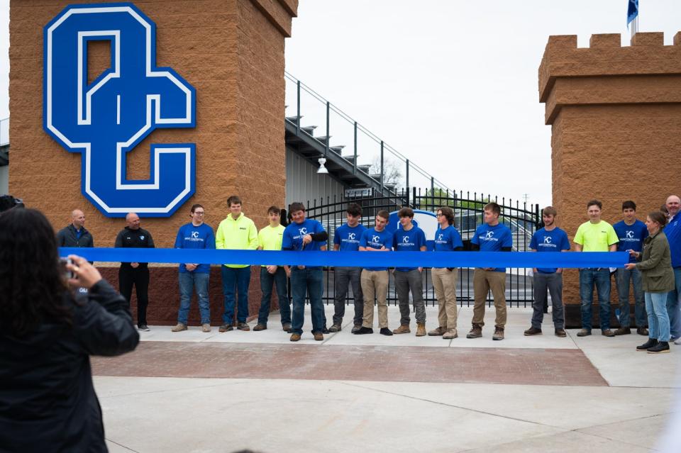 Oak Creek High School Knight Construction students celebrate completion of the school’s renovated community stadium.