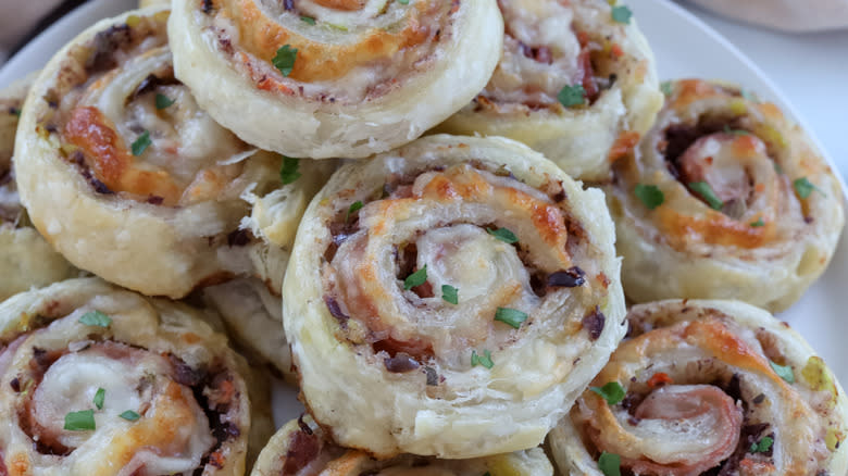 muffuletta pastry pinwheels on plate