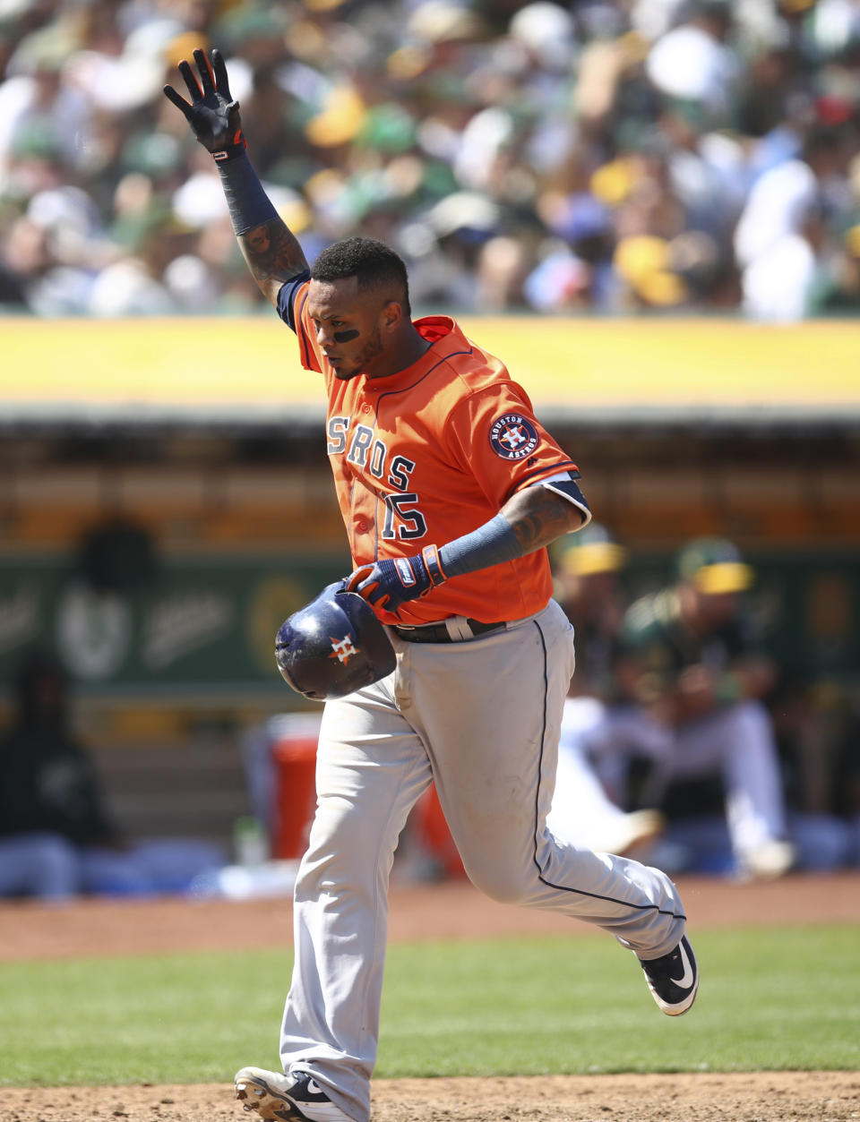 Houston Astros' Martin Maldonado celebrates after hitting a home run off Oakland Athletics' Emilio Pagan in the seventh inning of a baseball game Sunday, Aug. 19, 2018, in Oakland, Calif. (AP Photo/Ben Margot)